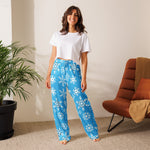 woman in a living room photo with snowflake winter pants