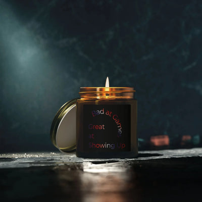 Bad at Games Soy Wax Candle - Amber Glass Jar on Dark Surface - Detail 29 | Our Phoenix Rise