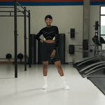 Black Neon Grid Long Sleeve Crop Top - Woman posing in bright fitness studio | Our Phoenix Rise