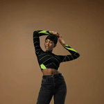 Black Neon Grid Long Sleeve Crop Top - Model demonstrating movement, studio shot | Our Phoenix Rise