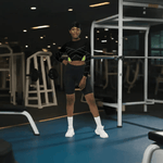 Black Neon Grid Long Sleeve Crop Top - Front view on model in workout setting | Our Phoenix Rise