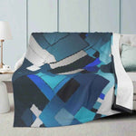 Blue Geometric Fleece Throw Blanket - On light blue couch | Our Phoenix Rise