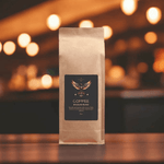 Fair Trade Brazilian Blend Coffee 16oz - Slightly angled front view, warm lighting | Our Phoenix Rise