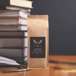 Fair Trade Brazilian Blend Coffee 16oz - Against blurred background, close-up | Our Phoenix Rise