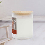 Left side angle of Cinnamon Chai warming wellness candle showing the sleek vessel shape.