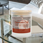 Front view of Cinnamon Chai scented aromatherapy candle in a frosted glass jar. Features a raw maple wood lid.