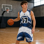 Custom Basketball Jersey and Shorts Set - Lifestyle mockup of player holding basketball in arena | Our Phoenix Rise