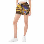 Liquid Gold Athletic Shorts - Dynamic pose showing flexibility | Our Phoenix Rise