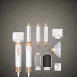 7-in-1 Professional Hair Dryer Brush with gold and white attachments for volumizing, curling, and styling. Includes diffuser, brush heads, and curling barrels.