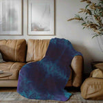 Purple Teal Abstract Fleece Throw Blanket - Folded on Wooden Surface | Our Phoenix Rise