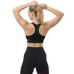 Endurance Longline Sports Bra - Black, back view, model flexing arms | Our Phoenix Rise