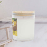 Left side angle of Mango Coconut Tropical Escape wellness candle showing the sleek vessel shape.