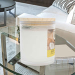 Right side angle of Mango Coconut soy blend candle. Close-up on the frosted glass finish.