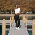Black Flame Water Resistant Track Pants - woman standing by lake | Our Phoenix Rise