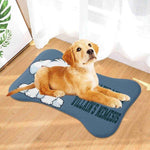 Funny Dog Food Mat - golden retriever puppy lying on bone shaped mat by window | Our Phoenix Rise