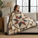 Woven throw blanket with star pattern in beige, navy, and rust colors on woman sitting on beige sofa | Our Phoenix Rise