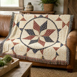 Woven decorative throw blanket beige red blue front draped on brown leather sofa | Our Phoenix Rise