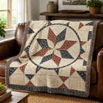 Woven quilt with red and blue star pattern draped on brown leather sofa | Our Phoenix Rise