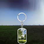 Personalized Dog Tag Keychain - Puppy Power design, distant view with green field and sky | Our Phoenix Rise
