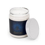 Candle in a glass jar with a dark blue label featuring a lotus design and text on a white background