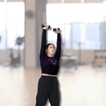 Soaring Bird Cropped Rash Guard Women's UPF 50+ - Woman lifting weights in deep violet cropped rash guard with bird logo | Our Phoenix Rise