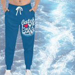 Blue Surfer Print Joggers - Laid flat with ship wheel background | Our Phoenix Rise