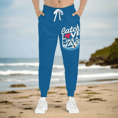 Blue Surfer Print Joggers - Man wearing joggers on beach | Our Phoenix Rise