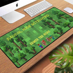 Block World Gaming Desk Mat - Wide Angle Perspective of Pixel Game Landscape with Text | Our Phoenix Rise