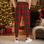 Ugly Christmas Plaid Joggers - Red Tartan Lifestyle Mockup with Plant | Our Phoenix Rise