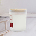 Left side angle of Vanilla frosted glass candle showing the sleek vessel shape and premium wood lid texture.