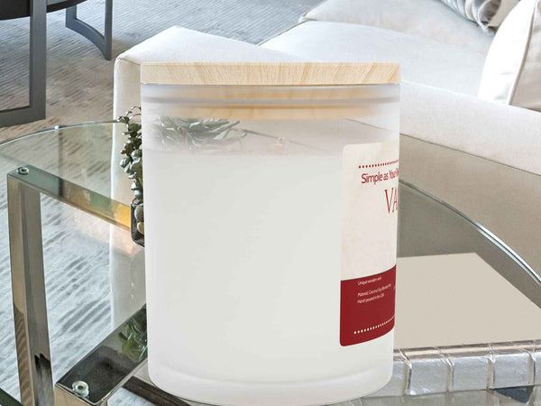 Right side angle of Vanilla soy blend candle. Close-up on the frosted glass finish and eco-friendly wax fill.