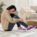 Woman sitting in Purple Galaxy Print Canvas Sneakers with white soles | Our Phoenix Rise