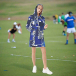 Geometric Print Hoodie Dress - Model in blue geometric block pattern walking | Our Phoenix Rise