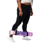 Yoga mat with purple galaxy print held by person in black leggings side angle | Our Phoenix Rise