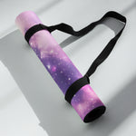 Rolled purple galaxy print yoga mat with black carrying strap angled | Our Phoenix Rise