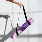 Purple galaxy print yoga mat rolled with black straps held by hand | Our Phoenix Rise